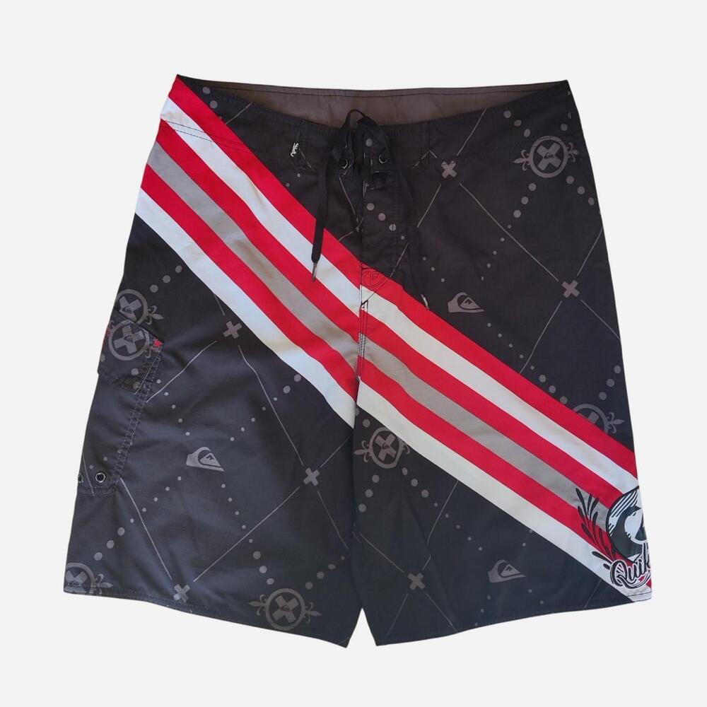 Y2K Quiksilver black baggy board shorts with red/white diagonal stripes and gray